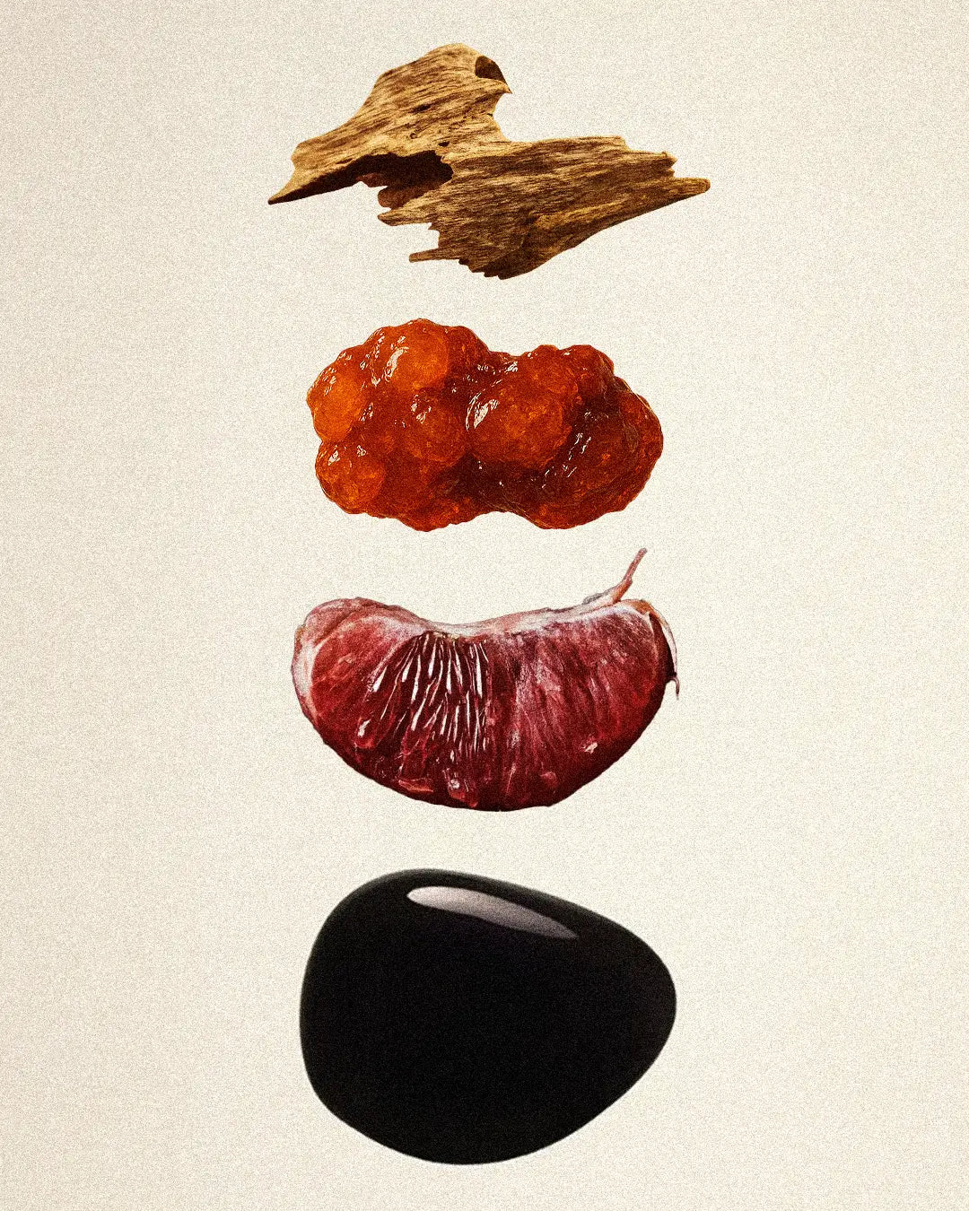 Editorial luxury fragrance layering image with resin, wood, fruit, and black stone representing Eau De Parfum composition